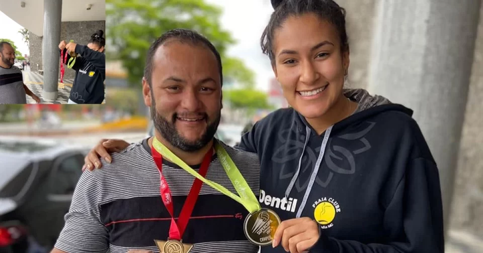 Campeã mineira e da Supercopa com o Praia Clube, chegando em São Paulo, Tai de Jandira entrega medalhas ao papai.